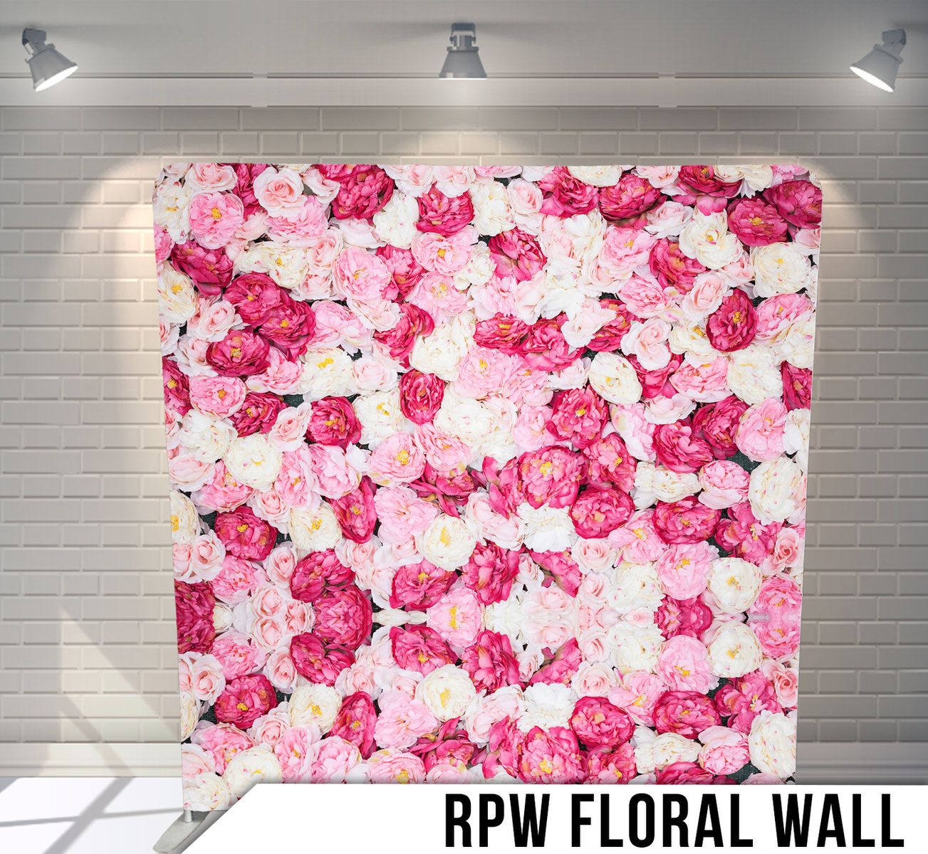 Pink and fuchsia floral wall backdrop with densely packed roses for romantic photography.