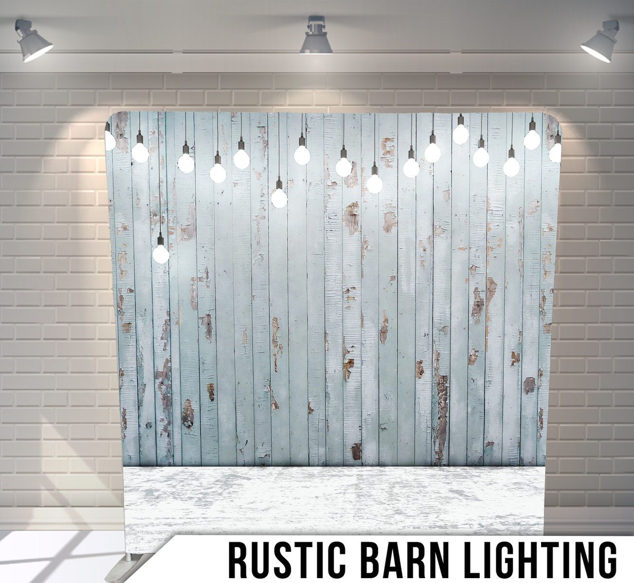 White distressed wood planks with hanging Edison bulbs creating ambient lighting.
