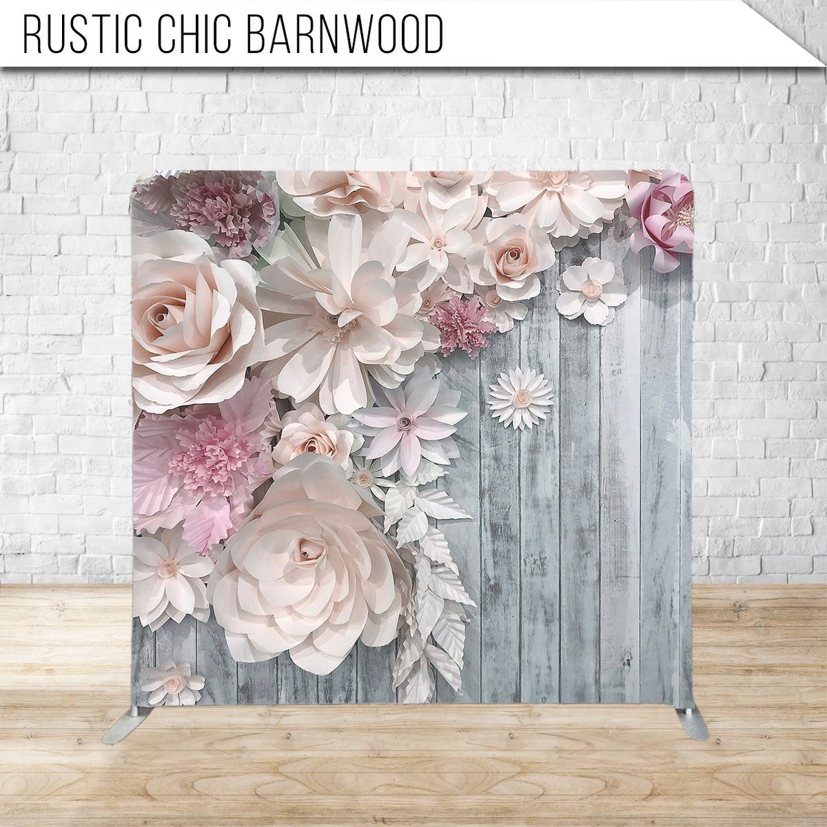 Rustic barnwood backdrop with delicate pink and white paper flowers.