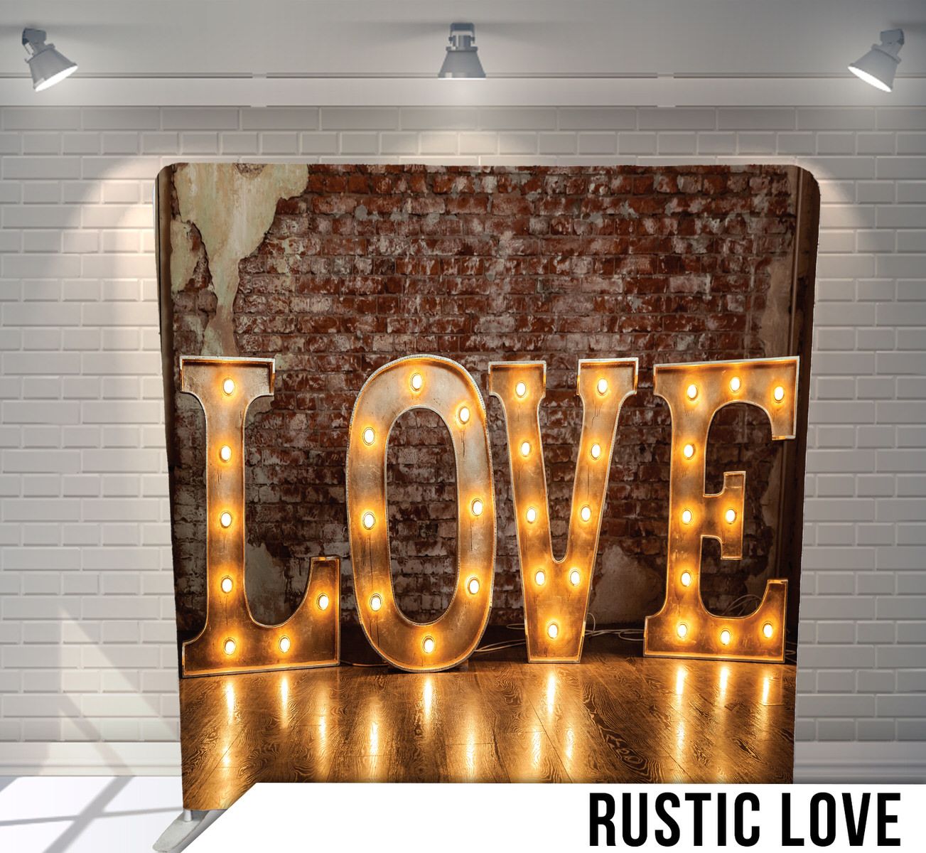 Illuminated LOVE marquee letters against weathered brick wall background.