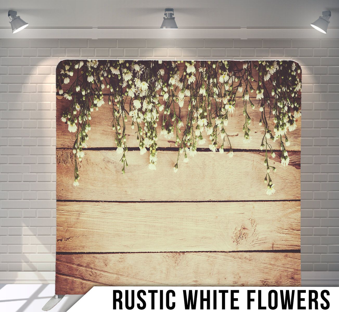 Delicate white flowers hang from above against a rustic wooden backdrop creating a romantic backdrop design.