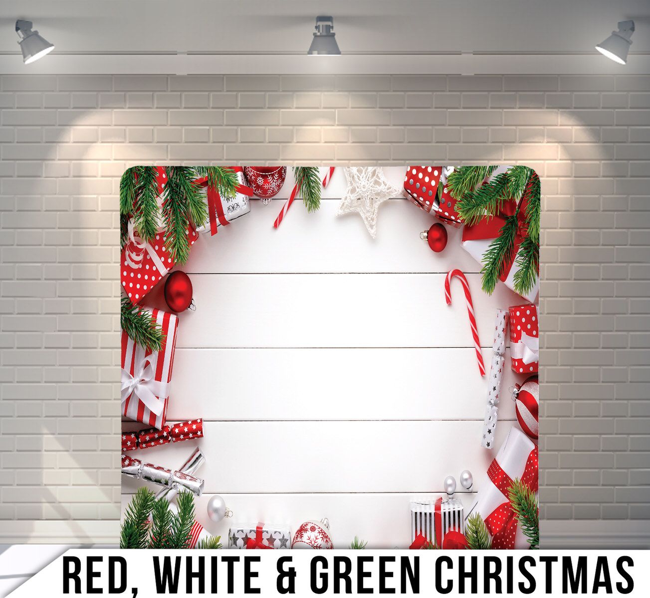 Christmas themed border with pine branches, red ornaments, and white decorative elements on wooden background.