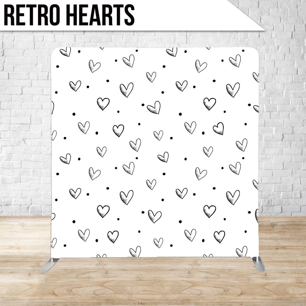 Hand drawn black hearts scattered on white background in a repeating pattern.