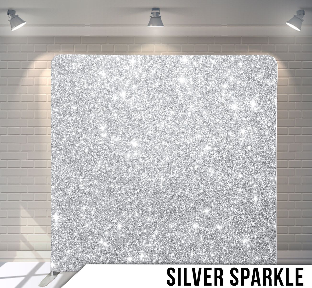 Glittering silver sparkle background with twinkling effect under studio lighting.