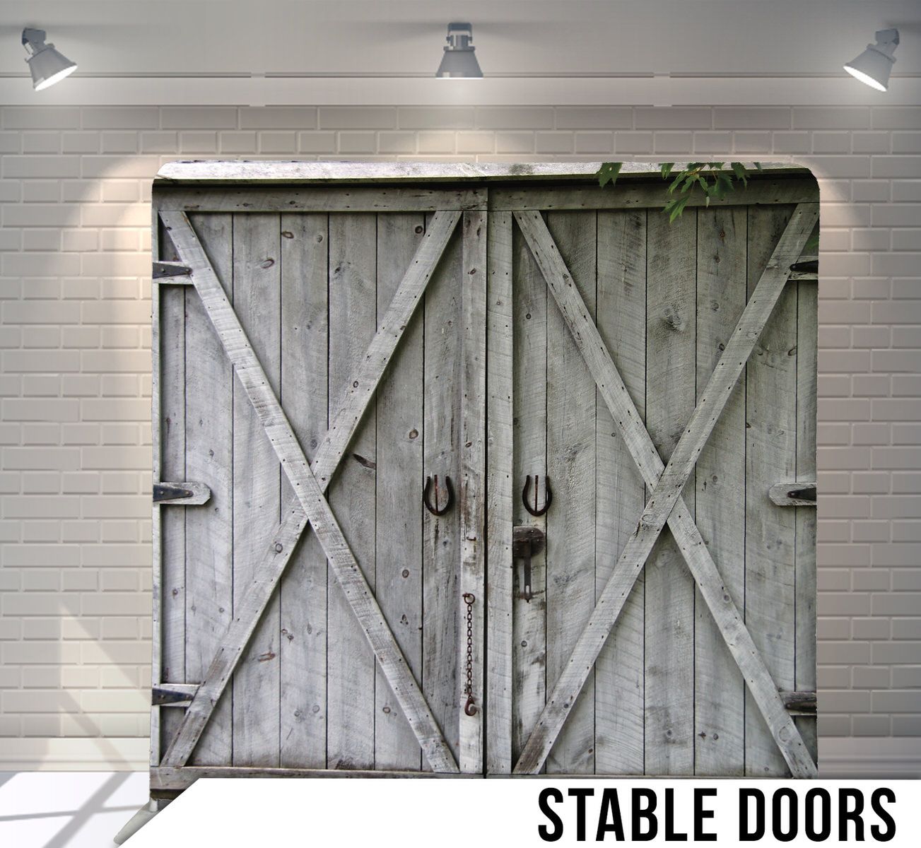 Weathered gray wooden barn doors with X-frame design and metal handles.