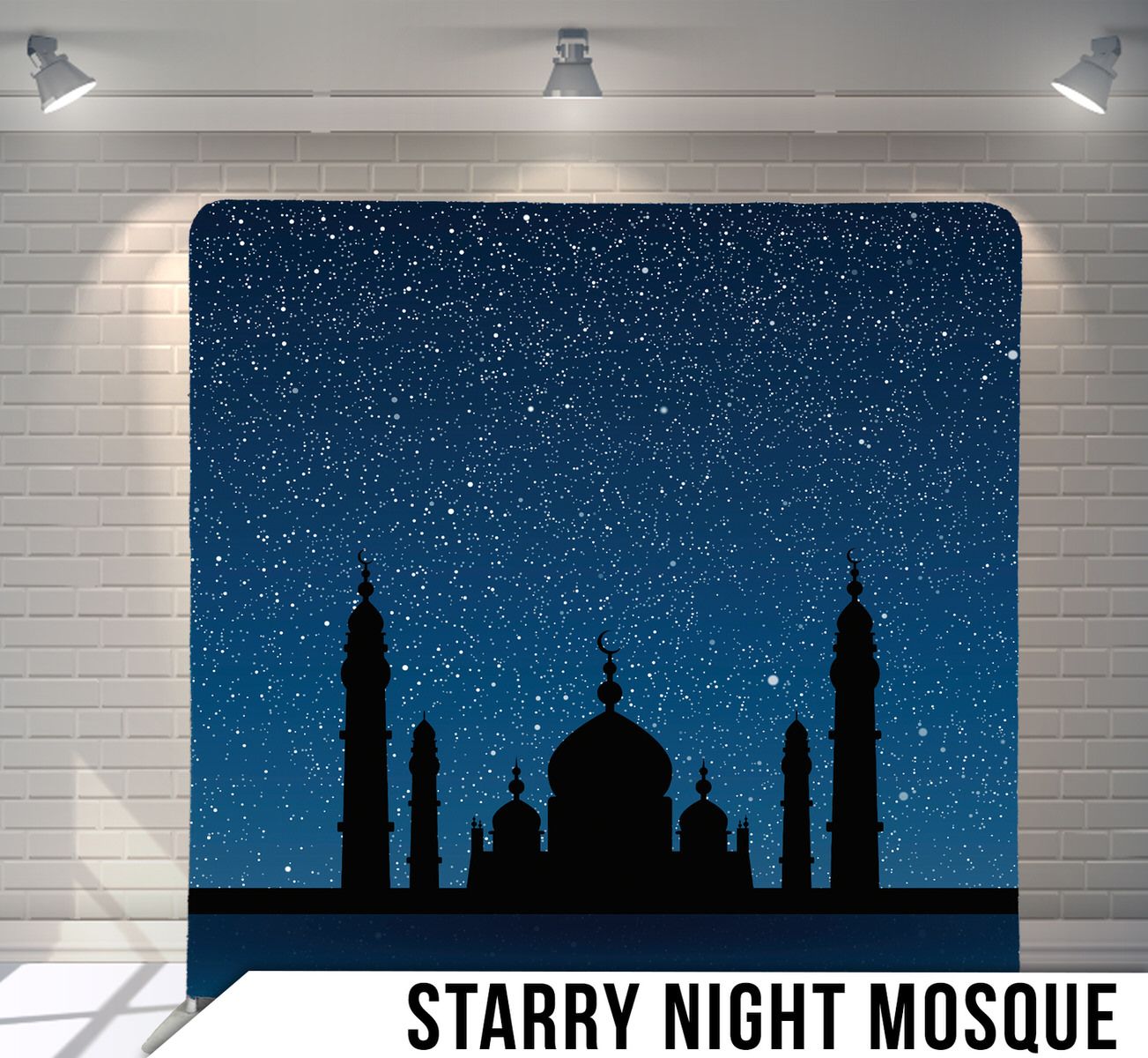 Silhouette of a mosque with minarets against a starry night sky background.