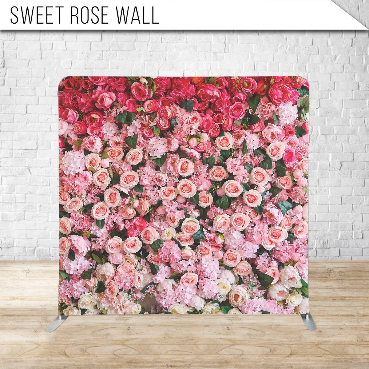 Pink and red roses create a lush floral wall backdrop with romantic garden appeal.