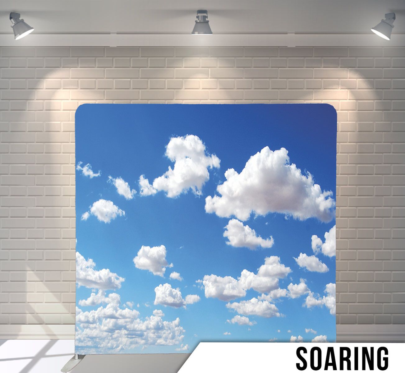 White fluffy clouds scattered across bright blue sky background.