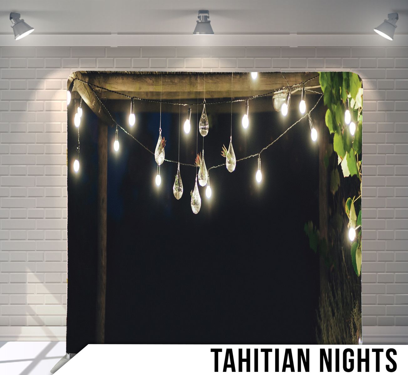 String lights and glass bulbs create a romantic outdoor ambiance against dark night sky.
