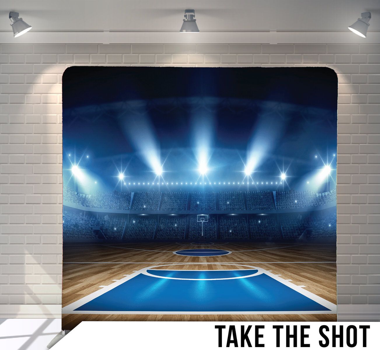 Indoor basketball court with dramatic blue lighting and spotlights illuminating empty arena.