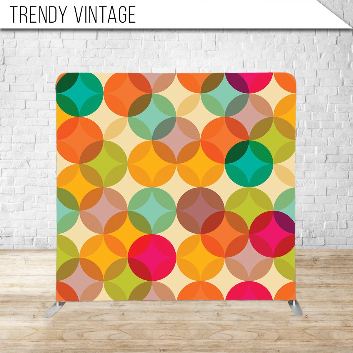 Colorful retro pattern with overlapping translucent circles in orange, green, pink and yellow tones on display.