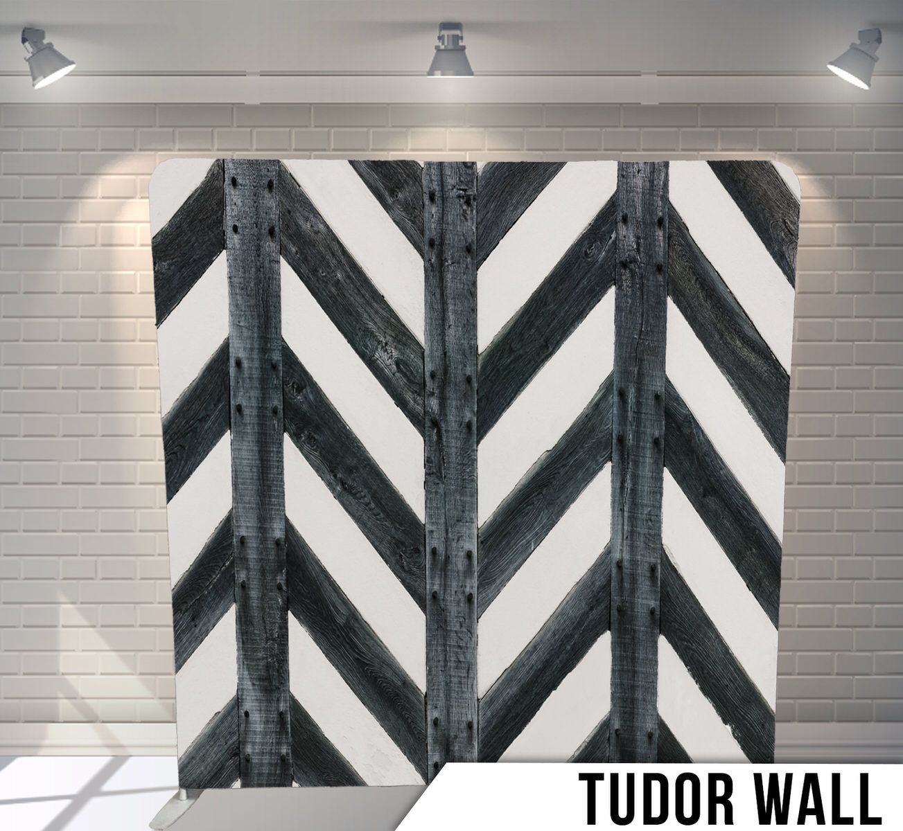 Black and white chevron pattern with industrial metal rivets on tudor style wall.