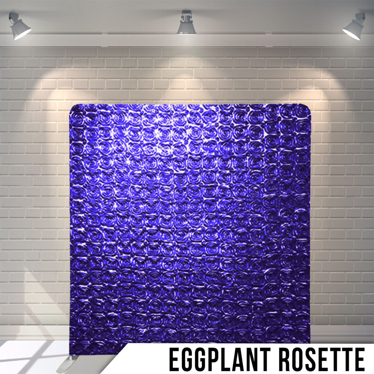Deep eggplant purple rosette textured backdrop with dramatic overhead lighting and brick wall background.