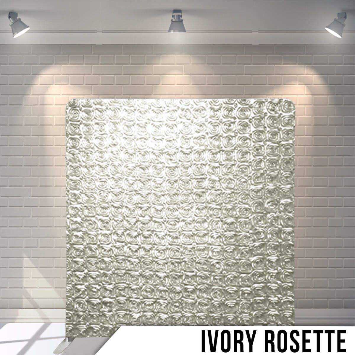 Elegant ivory rosette patterned backdrop panel with textured fabric design under spotlights.