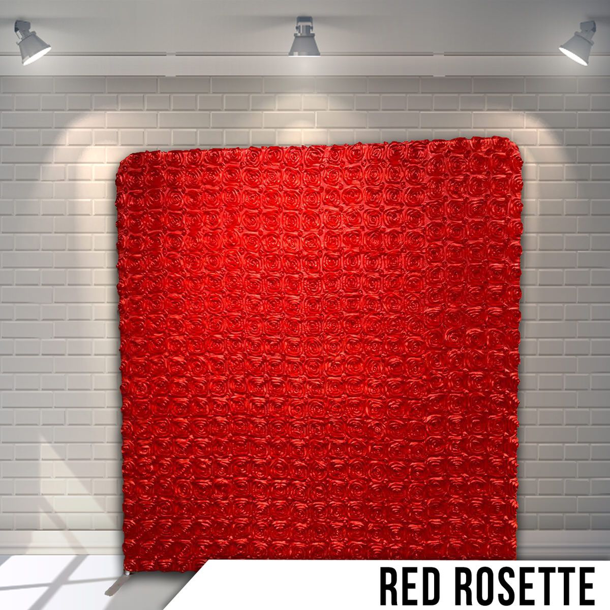 Bright red rosette patterned backdrop display with textured fabric under overhead spotlights.