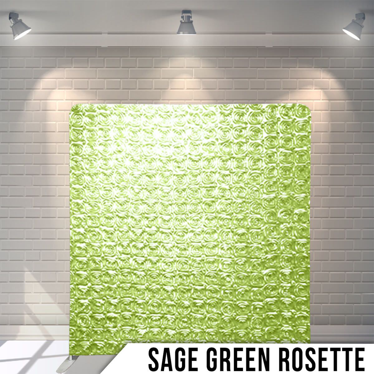 Decorative sage green rosette textured backdrop panel with spotlights illuminating the wall.
