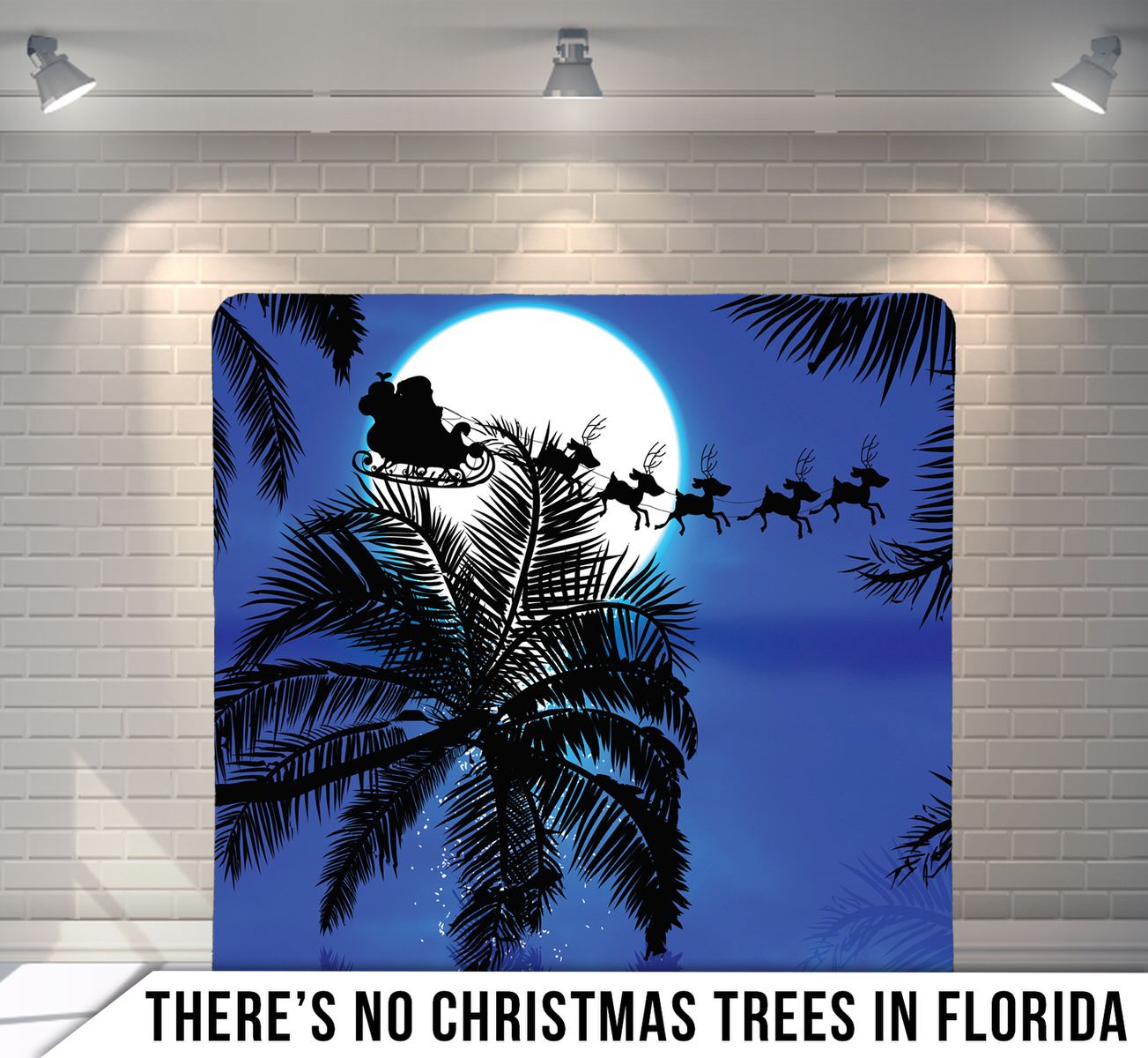 Silhouette of palm trees against full moon with Santa's sleigh crossing night sky.