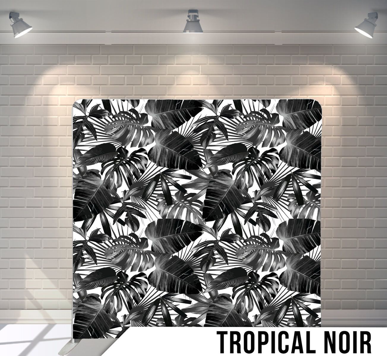 Black and white tropical monstera leaf pattern creating a bold contrast.