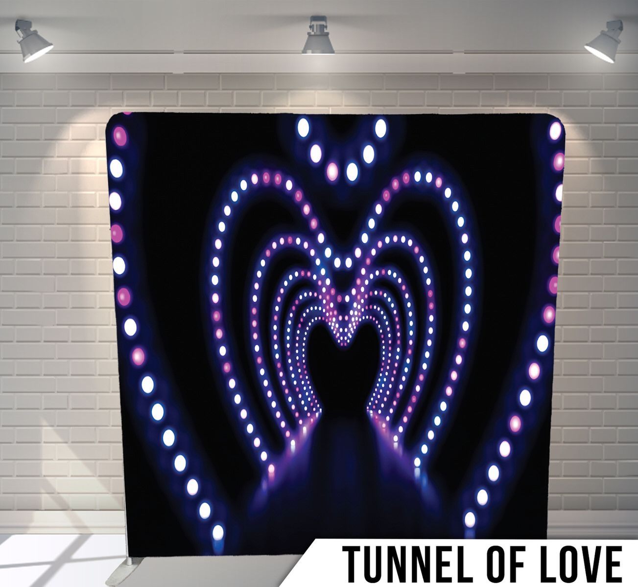 Illuminated tunnel with purple LED lights forming heart shapes creating an infinity effect.