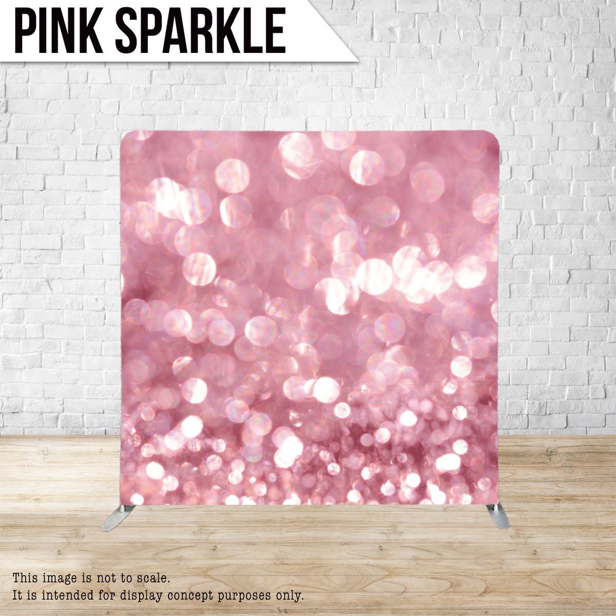 Sparkly pink bokeh effect backdrop with scattered light spots displayed against brick wall.