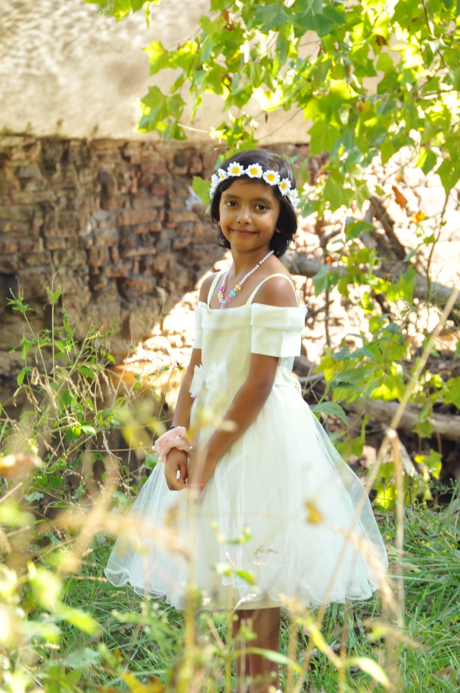 Photo of young girl near bridge outside