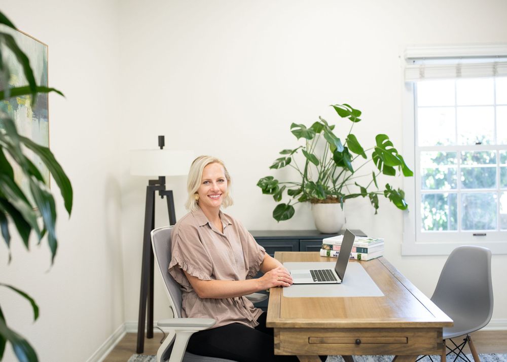 portrait of a woman doctor sitting at her office desk in santa barbara, ca
