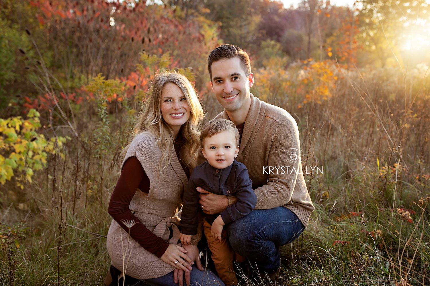 Golden family photograph with lots of smiles