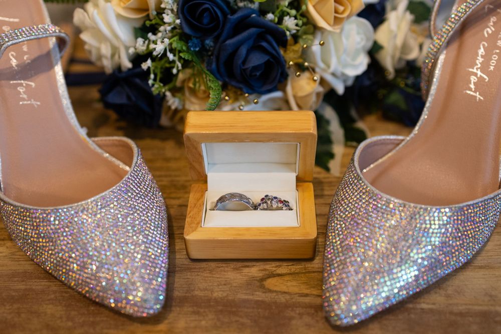 Brides shoes, rings and flowers before her wedding day in Brentwood, Essex