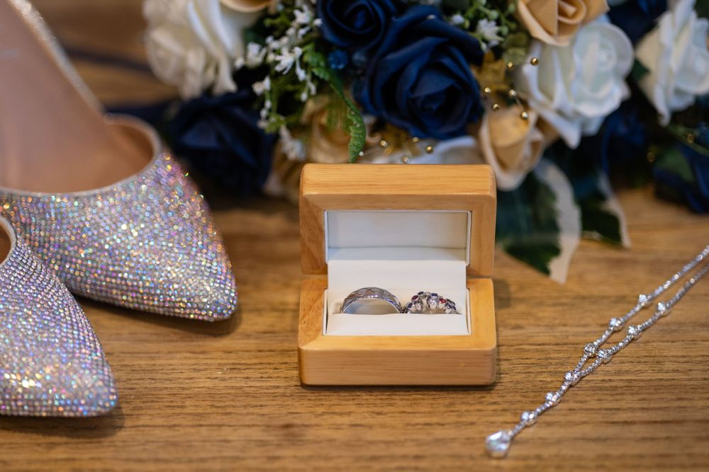 Brides details including shoes, rings and flowers