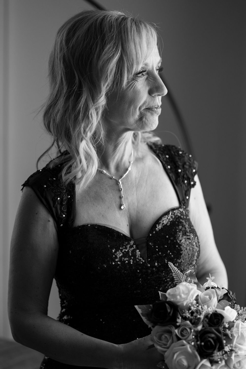 Bride looking out of the window, smiling