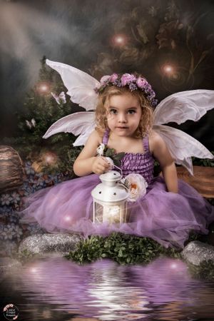 Enchanted fairy portrait with lantern and purple tulle dress reflecting on water.