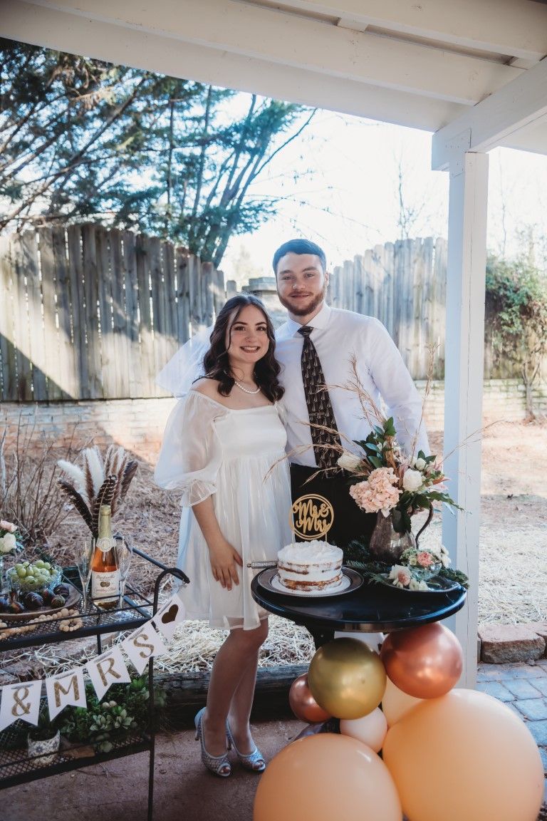 Young couple wedding with wedding cake