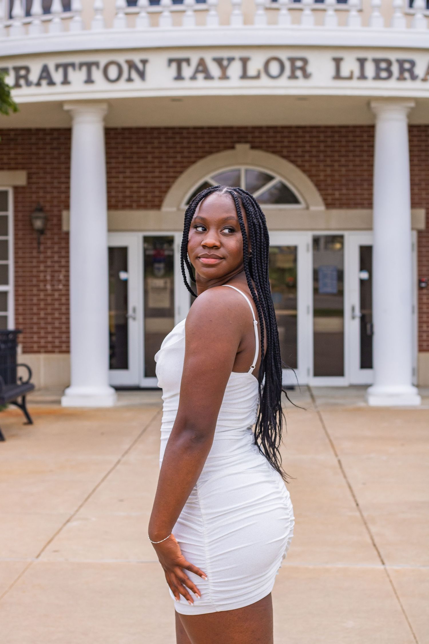 Maternity photos in front of Stratton Taylor Library building with white columns.