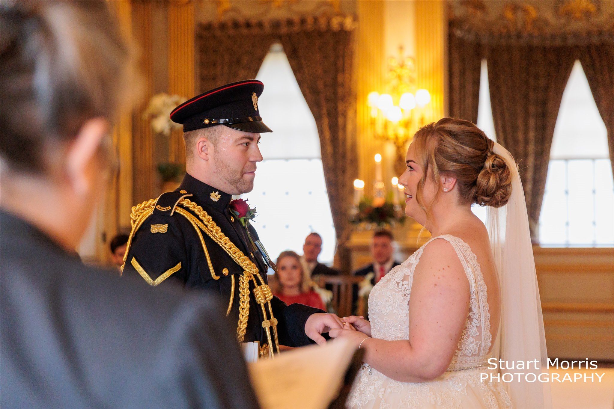 Bride and groom face each saying their bows. Knowsley hall wedding photographer Liverpool wedding photography