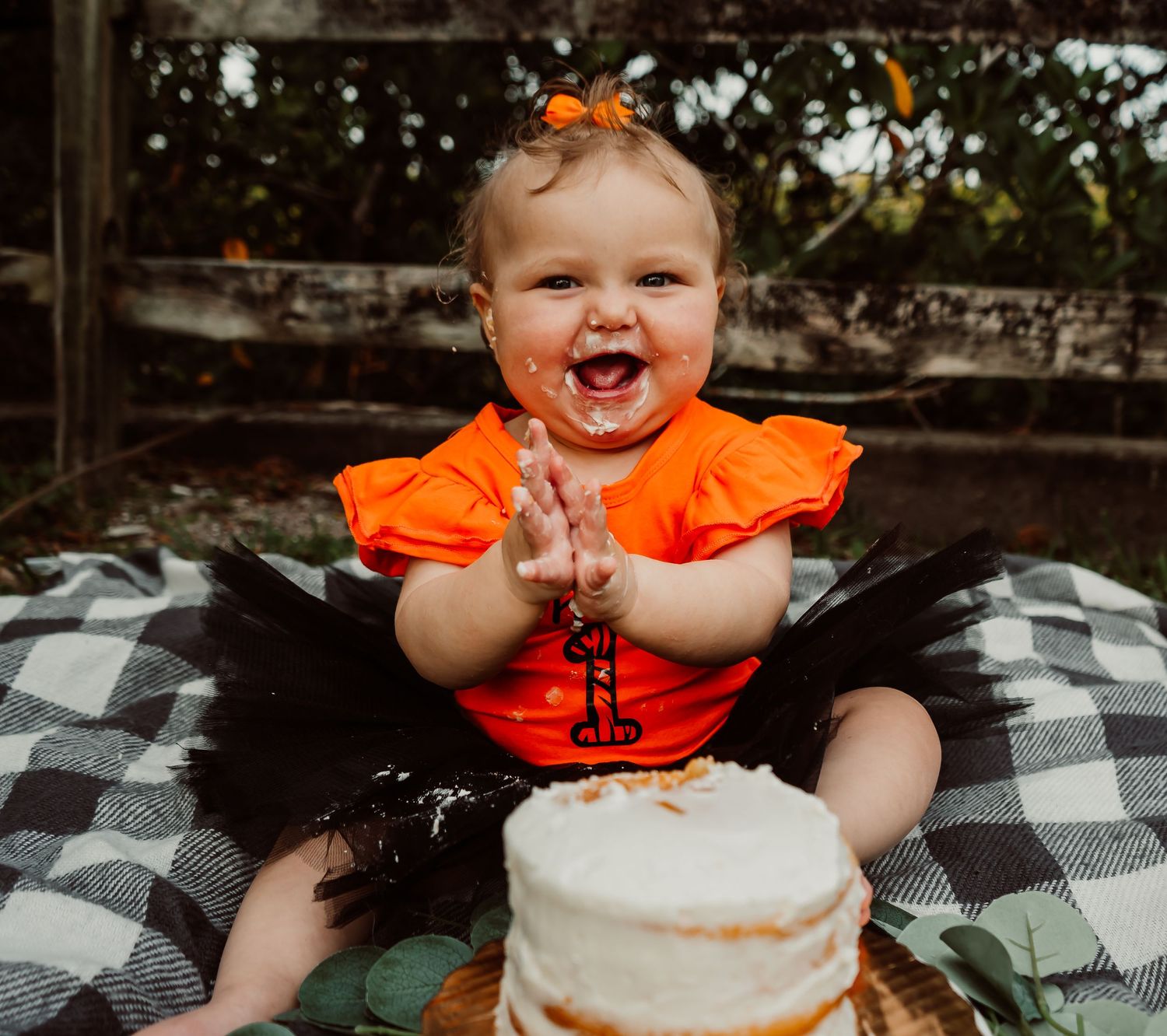Outdoor Cake Smash Session at Indian Rocks Beach, Indian Rocks, FL; Baby clapping sitting with cake