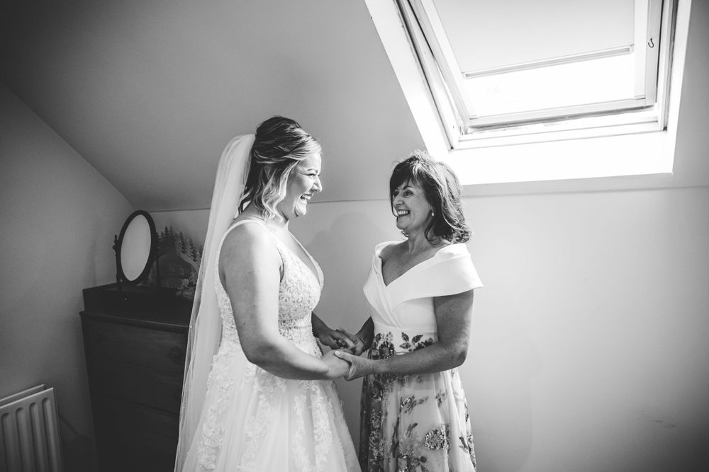 Natural light streams through skylights during bridal preparation moments.