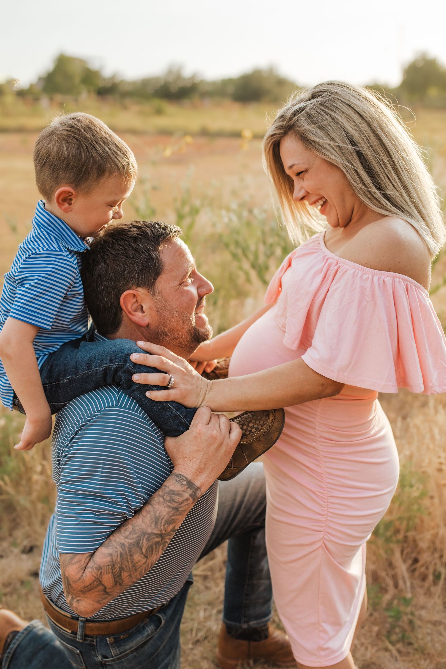 Maternity image with toddler on dad's shoulders