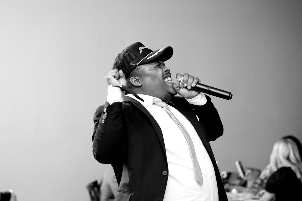 Black and white photos of entertainment and dancing at an evening wedding reception.