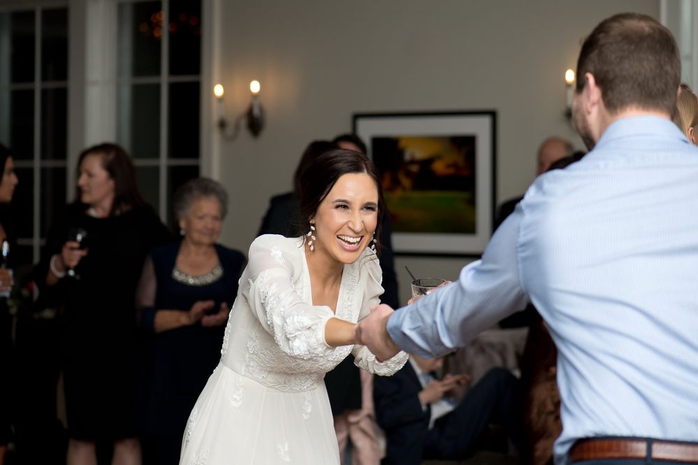 Wedding reception dance floor moments captured during an evening celebration.