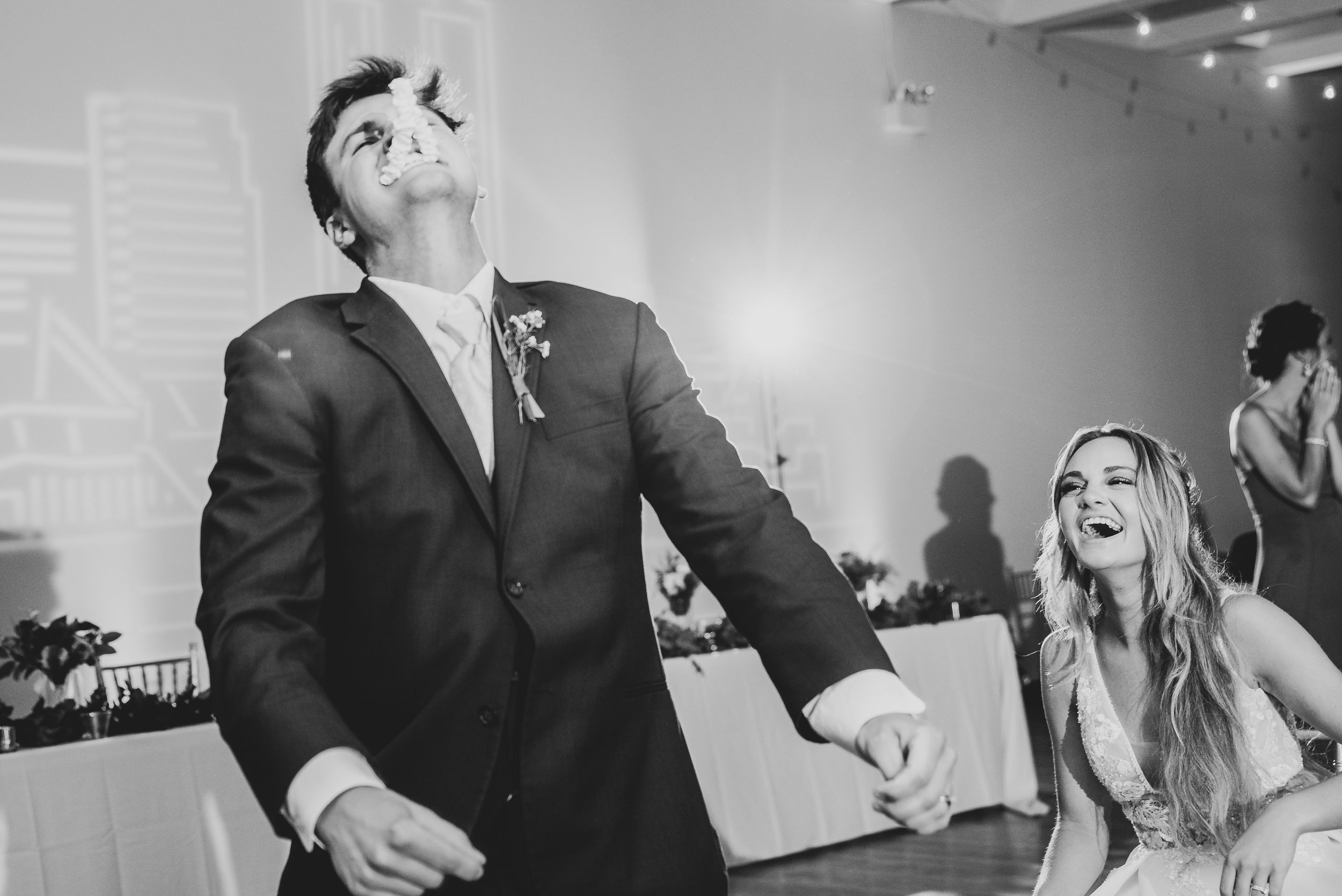 Guests enjoy dancing and celebrating at an indoor wedding reception.