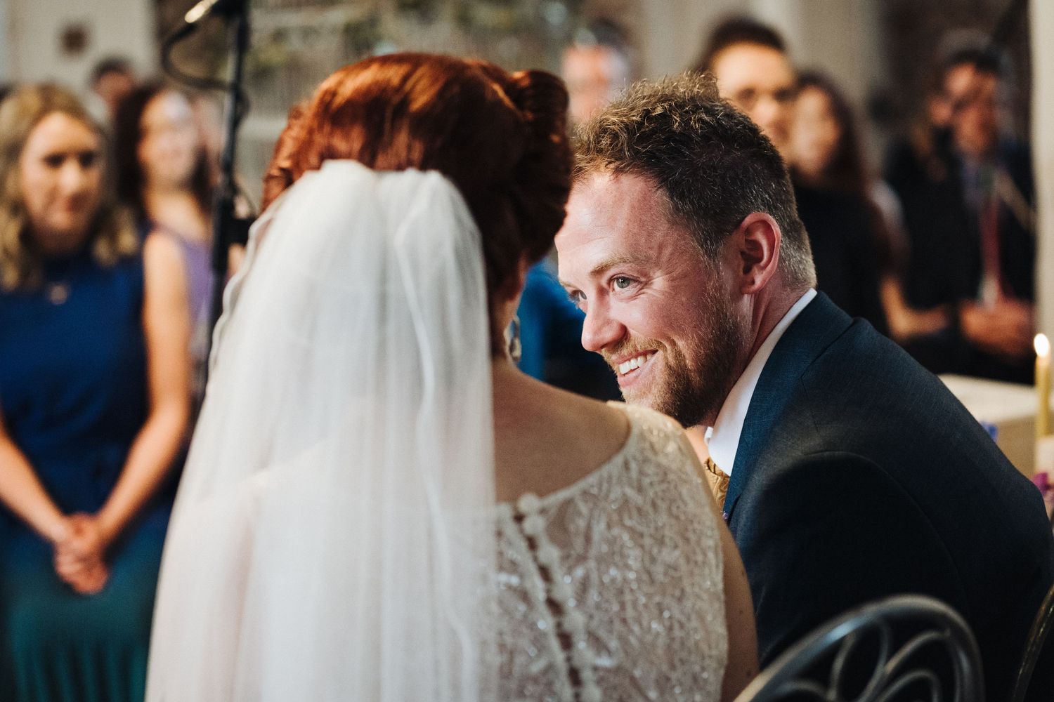 Emotional wedding ceremony moment captured during exchange of vows.