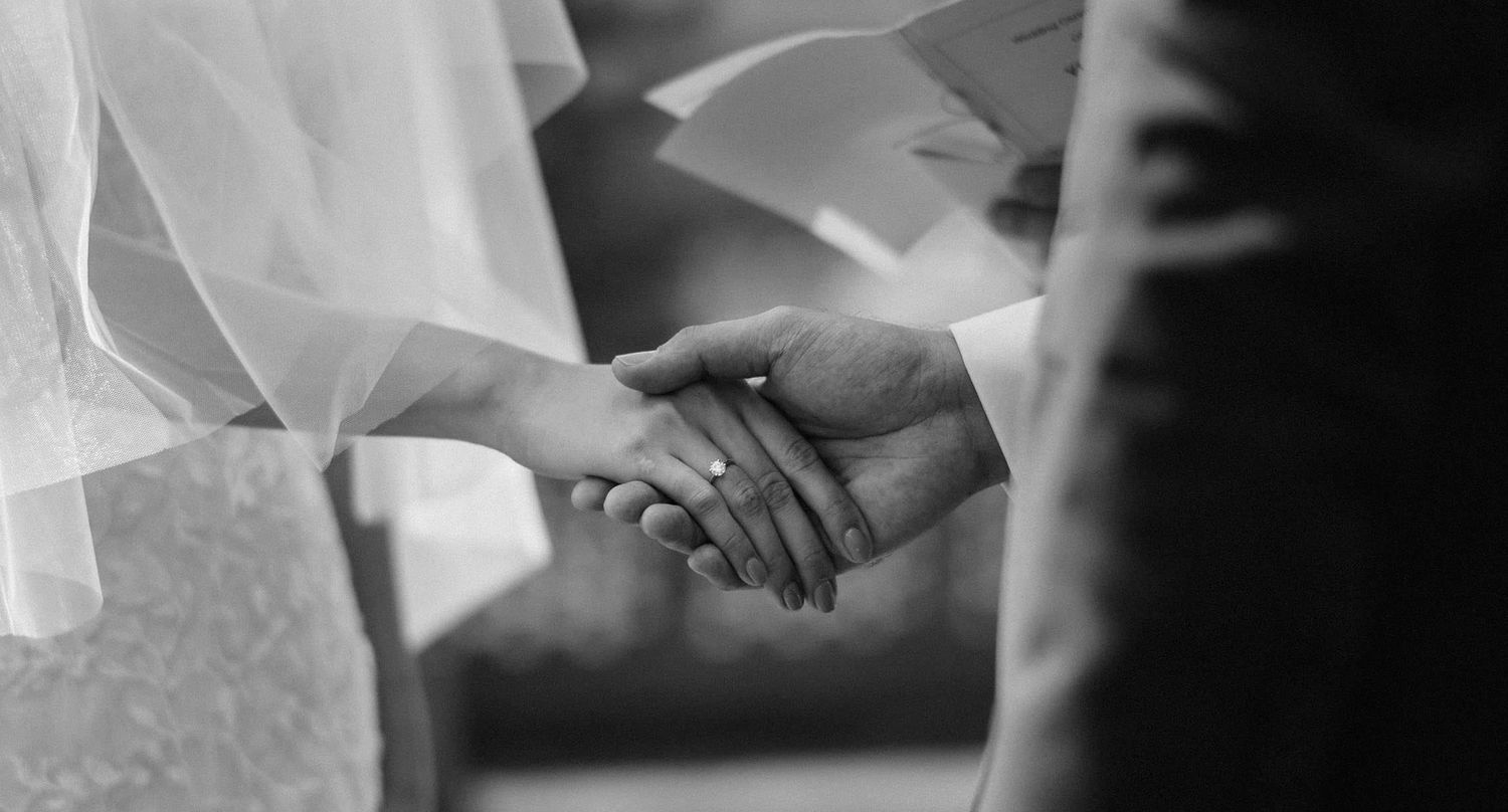 groom holding bride hand during pandemic covid 19