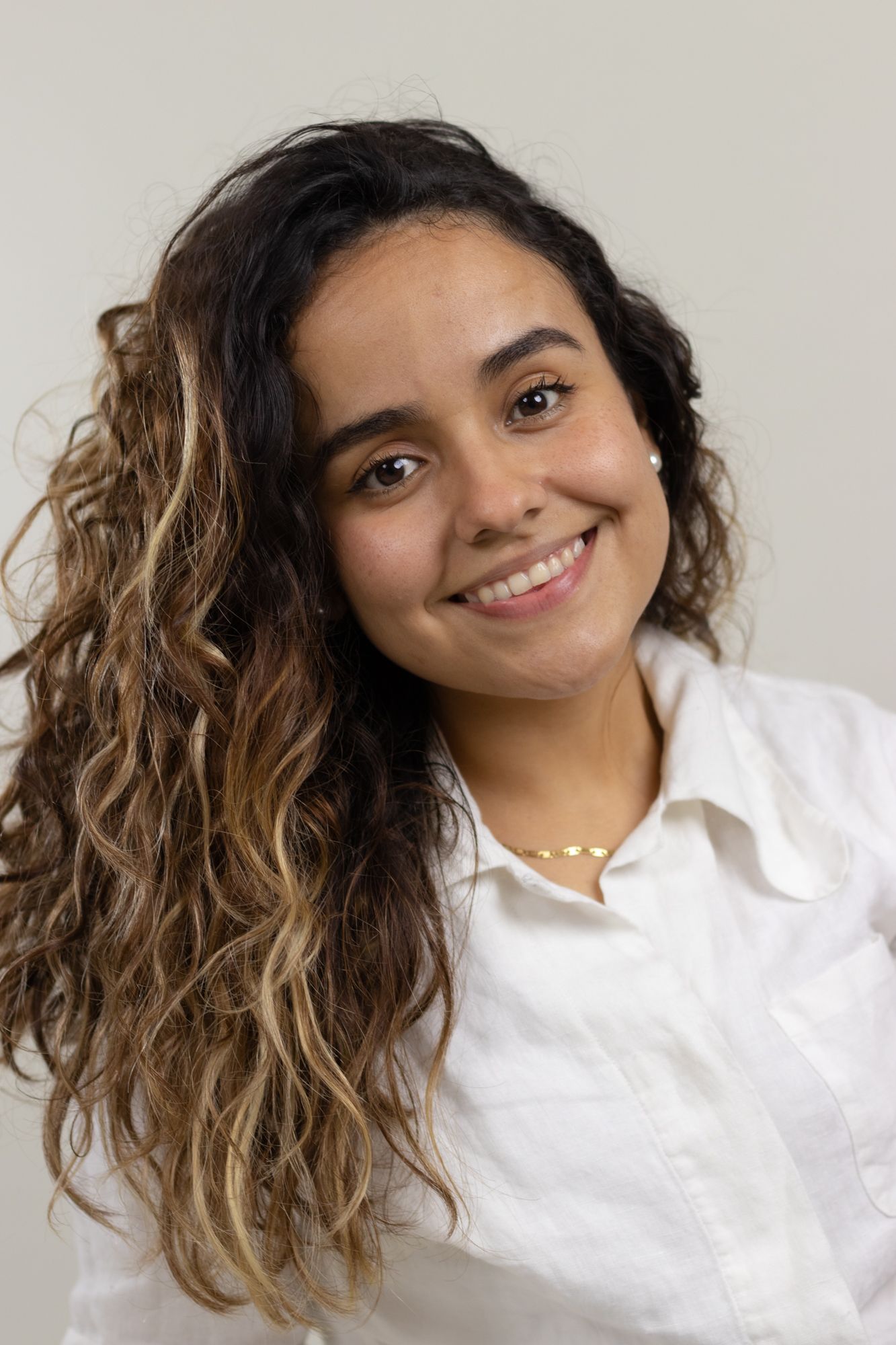 Casual portrait series showing different poses in a white collared shirt.