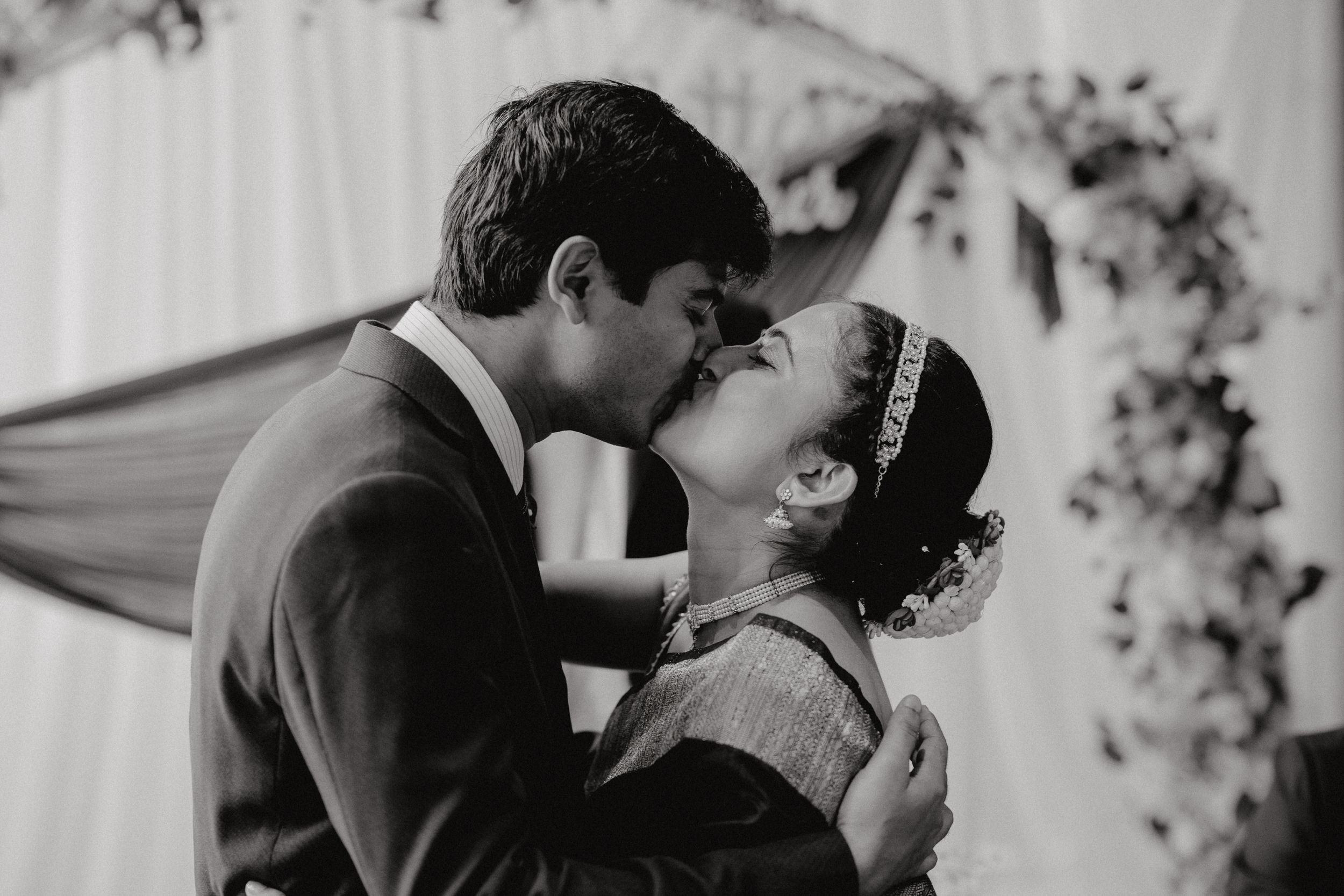 Dramatic shot of couple kissing during solemnization