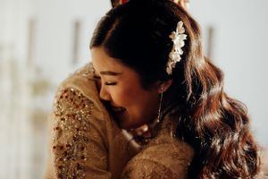 Bride hugs groom for this dramatic shot