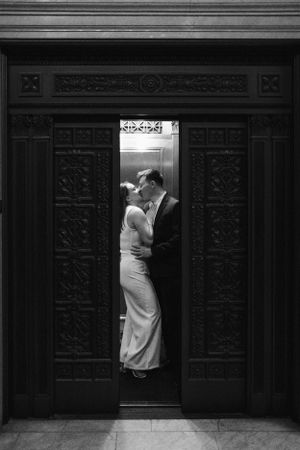 A black and white sequence of romantic wedding photos against ornate wooden doors.