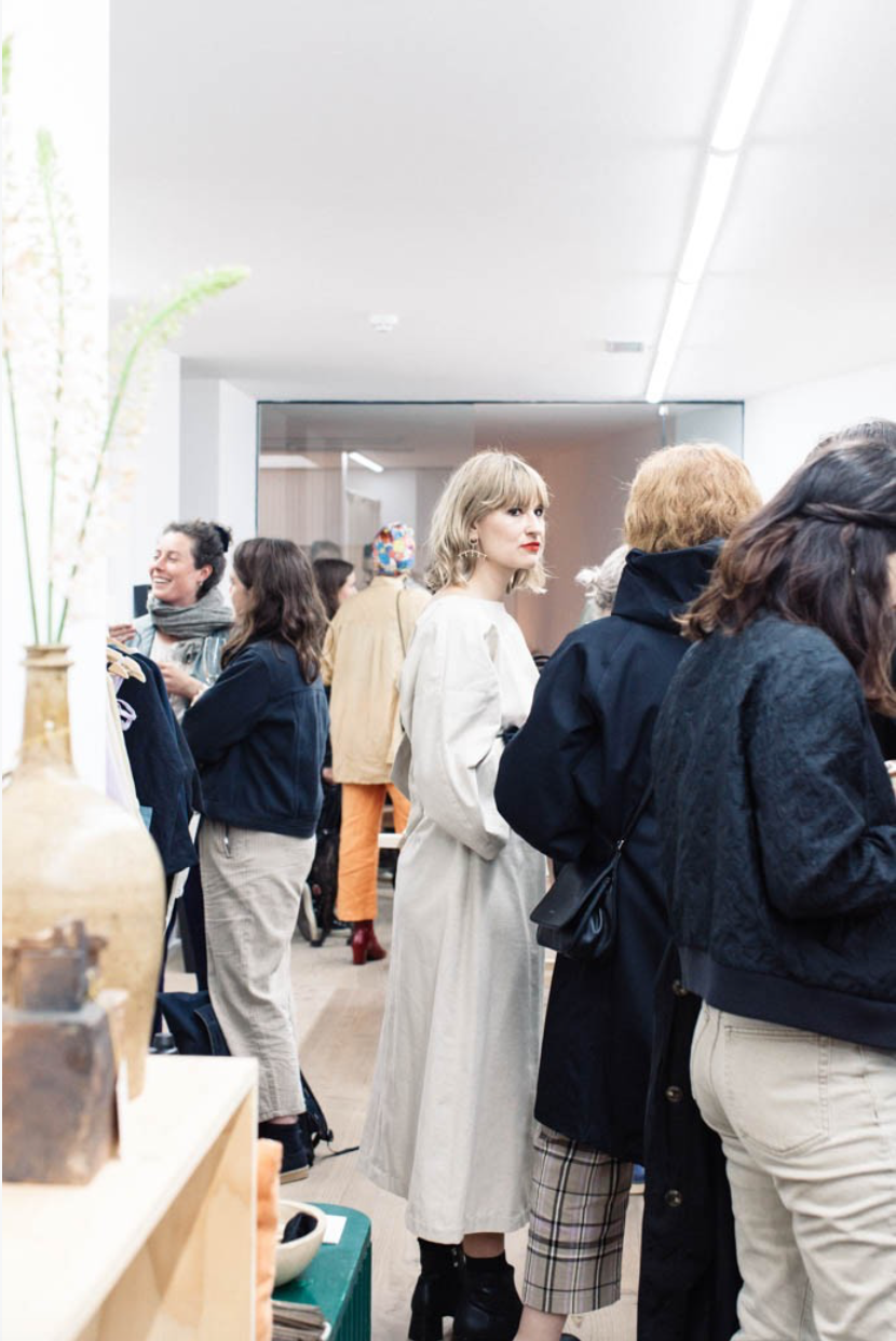 Portrait of Olivia Crighton surrounded by guests at the launch of A Sustainable Department Store