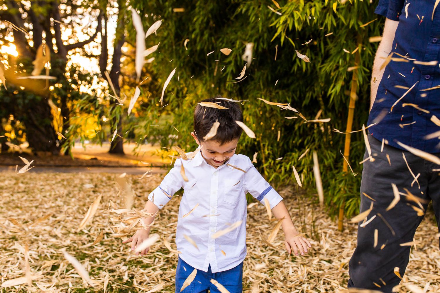 Son having fun with bamboo leaves at McAuliffe Park in Kirkland