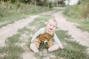 A playful sequence of photos taken on a dirt path surrounded by grass and nature.