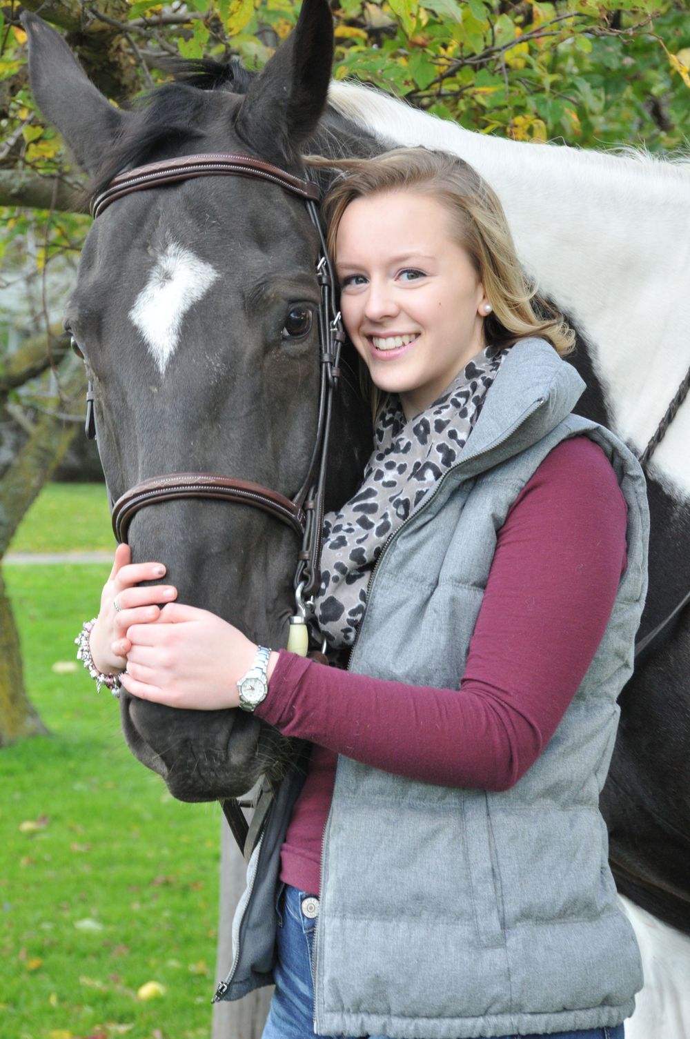 high school senior girl with horse close up